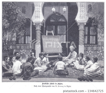 Arab School in Algiers: Children Gather in a Courtyard Classroom with Teacher, Chalkboard, and Traditional Attire in a Historic Architectural Setting Arab School in Algiers: Children Gather in a Courtyard Classroom with Teacher, Chalkboard, and Traditional Attire in a Historic Architectural Setting 134642725