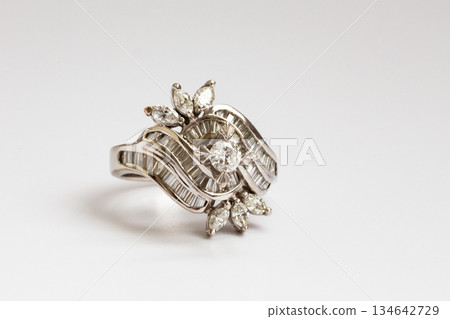 A stunning large white gold ring with natural round, marquise, and trapezoid diamonds. 134642729