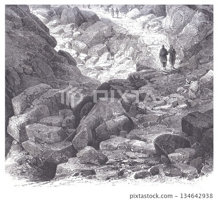 Rocky Mountain Trail With Two Hikers Walking Among Towering Boulders Landscape Rocky Mountain Trail With Two Hikers Walking Among Towering Boulders Landscape 134642938