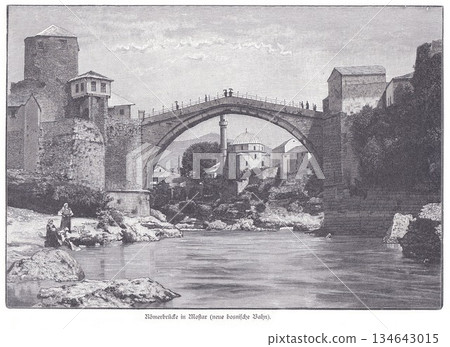 Mostar Old Bridge Over Neretva River, Stone Arch Crossing With Historic Towers and Mosque in Background 134643015