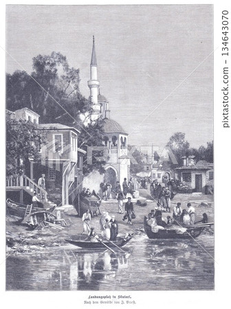 Historic Waterfront Village Scene With Mosque Minaret And Busy Riverbank Activity Historic Waterfront Village Scene With Mosque Minaret And Busy Riverbank Activity 134643070