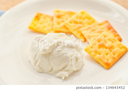Homemade cream cheese and crackers 134643452