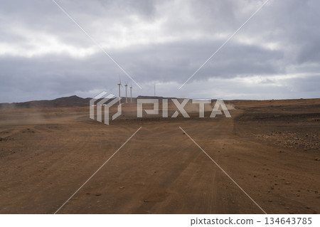 Panoramic view of three wind turbines in a Cape Verde desert 134643785
