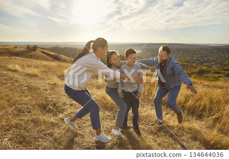 Happy playful family nature outdoor rest, spending weekend holiday together, parents, children 134644036
