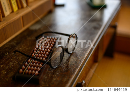 Abacus and glasses still life 134644439