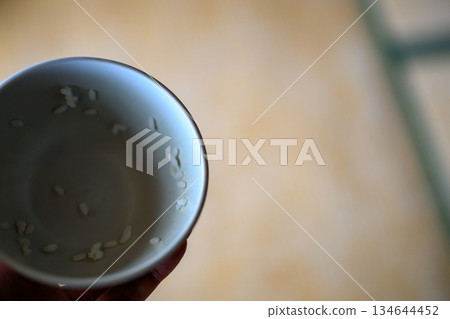 Rice grains remaining in a bowl Rice grains remaining in a bowl 134644452