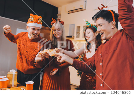 Festive Office Christmas Party with Delicious Food. A beautifully decorated office space with Christmas trees and festive lights, set up for a holiday party. 134646805