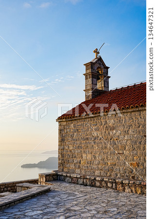 Saint Sava Church and Sveti Stefan Island Vertical Sunset View 134647321
