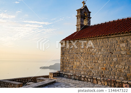 Saint Sava Church and Sveti Stefan Island at Sunset 134647322