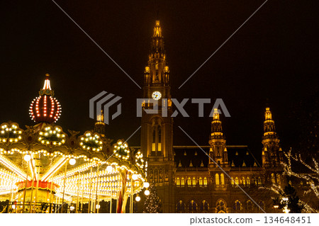 Christmas Card Night Shining City with Town Hall and Carousel, Christmas Market. Christmas Card Night Shining City with Town Hall and Carousel, Christmas Market. 134648451