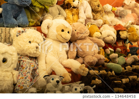 Assorted cute plush toys on a shelf, collection of soft stuffed animals for sale Assorted cute plush toys on a shelf, collection of soft stuffed animals for sale 134648458