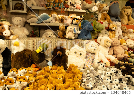 Assorted cute plush toys on a shelf, collection of soft stuffed animals for sale Assorted cute plush toys on a shelf, collection of soft stuffed animals for sale 134648465