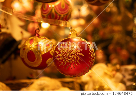 Beautiful Christmas baubles with traditional ornaments, cozy and warm Christmas card 134648475