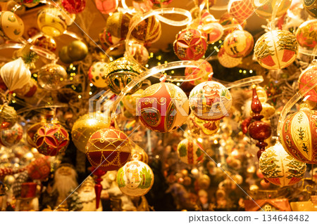 Christmas glass balls hanging on spiral transparent stands Christmas glass balls hanging on spiral transparent stands 134648482