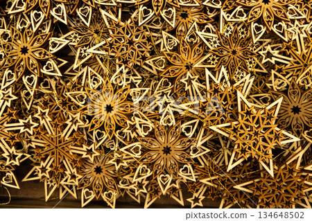 Eco-friendly Christmas decorations made of natural wood, wooden snowflake ornaments. 134648502