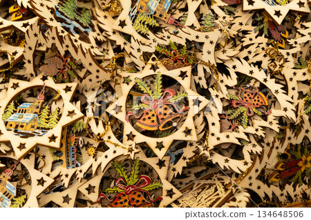 Hand-painted wooden Christmas stars with festive illustrations Hand-painted wooden Christmas stars with festive illustrations 134648506