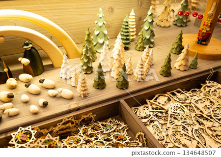 Assorted eco-friendly holiday ornaments in a gift shop at the Christmas market Assorted eco-friendly holiday ornaments in a gift shop at the Christmas market 134648507