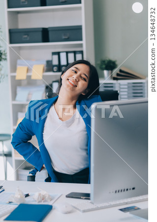 Asian women Aches from working She felt like relaxing Asian women Aches from working She felt like relaxing 134648732