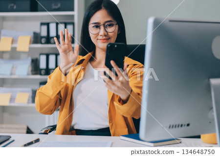 Business woman using calculator for do math finance on wooden desk in office and business working background, tax, accounting, statistics and analytic research concept. Business woman using calculator for do math finance on wooden desk in office and business working background, tax, accounting, statistics and analytic research concept. 134648750
