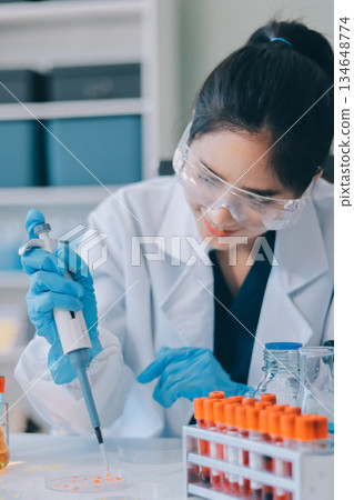 Portrait, science and happy woman on laptop in lab to research chemistry, test or innovation. Microscope, scientist and face of medical doctor in goggles for microbiology, healthcare or pharma study Portrait, science and happy woman on laptop in lab to research chemistry, test or innovation. Microscope, scientist and face of medical doctor in goggles for microbiology, healthcare or pharma study 134648774