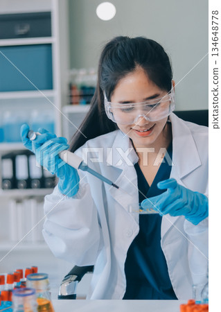 Portrait, science and happy woman on laptop in lab to research chemistry, test or innovation. Microscope, scientist and face of medical doctor in goggles for microbiology, healthcare or pharma study Portrait, science and happy woman on laptop in lab to research chemistry, test or innovation. Microscope, scientist and face of medical doctor in goggles for microbiology, healthcare or pharma study 134648778