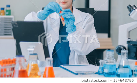 Portrait, science and happy woman on laptop in lab to research chemistry, test or innovation. Microscope, scientist and face of medical doctor in goggles for microbiology, healthcare or pharma study Portrait, science and happy woman on laptop in lab to research chemistry, test or innovation. Microscope, scientist and face of medical doctor in goggles for microbiology, healthcare or pharma study 134648796