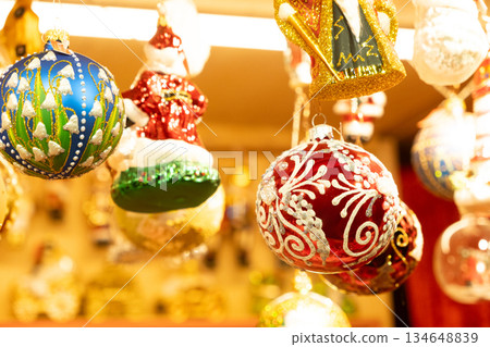 Beautiful Christmas baubles with traditional ornaments, cozy and warm Christmas card Beautiful Christmas baubles with traditional ornaments, cozy and warm Christmas card 134648839