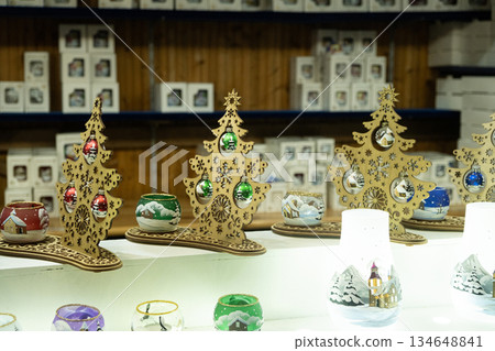 Wooden Christmas Tree Decorations with Glass Baubles at a Holiday Market Wooden Christmas Tree Decorations with Glass Baubles at a Holiday Market 134648841