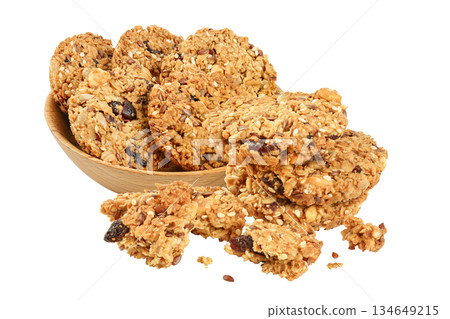 Granola cookie in wooden bowl isolated on white background with full depth of field. Granola cookie in wooden bowl isolated on white background with full depth of field. 134649215