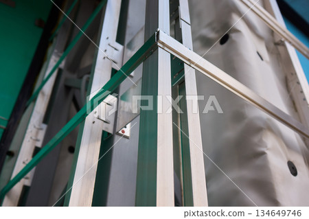 A Detailed Close Up View of the Intricate Frame Structure of a Modern Innovative Building Design A Detailed Close Up View of the Intricate Frame Structure of a Modern Innovative Building Design 134649746