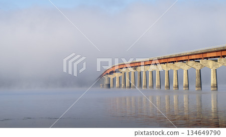 Natchez National Parkway - bridge over Tennessee River from Tennessee to Alabama, foggy November sunrise Natchez National Parkway - bridge over Tennessee River from Tennessee to Alabama, foggy November sunrise 134649790