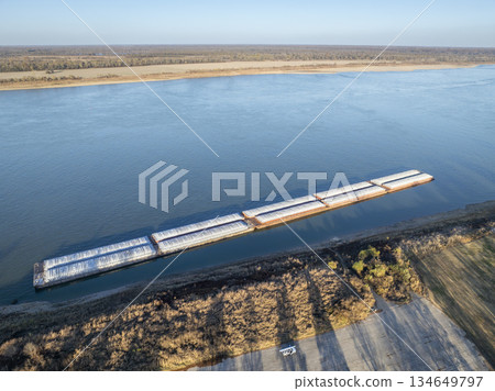 barges on the Ohio River at confluence with the Mississippi below Cairo, IL, November aerial view 134649797