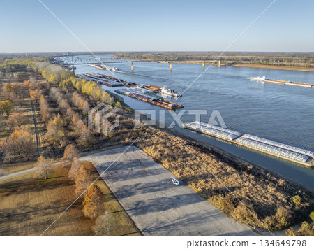 barges on the Ohio River at confluence with the Mississippi below Cairo, IL, November aerial view 134649798