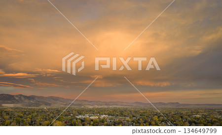 scenic sunrise cloudscape over Fort Collins and foothills of Rocky Mountains, fall scenery scenic sunrise cloudscape over Fort Collins and foothills of Rocky Mountains, fall scenery 134649799