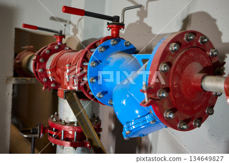 The system of industrial valves and pipes utilized in the facility is essential and intricate The system of industrial valves and pipes utilized in the facility is essential and intricate 134649827