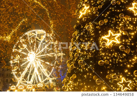 Magical Christmas Night View with Decorated Christmas Tree and Ferris Wheel 134649858