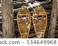 Classic wooden snowshoes (Huron)  in a backyard covered by snow 134649968