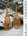 Classic wooden snowshoes (Huron)  in a backyard covered by snow 134649969