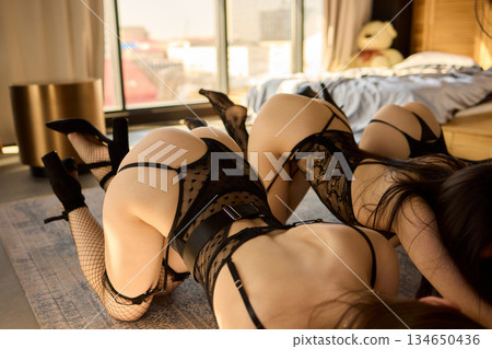 An Elegant Lingerie Photoshoot Features Three Stunning Models in Beautiful, Stylish Attire 134650436