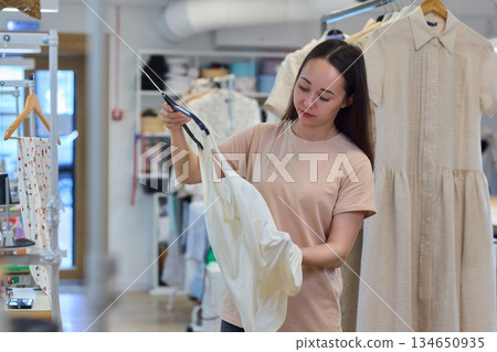 A Talented Fashion Designer is Diligently Engaged at Work in a Creative and Inspiring Studio Space A Talented Fashion Designer is Diligently Engaged at Work in a Creative and Inspiring Studio Space 134650935