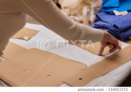 Tailoring Craftsmanship A Fashion Designer at Work Creating Beautiful Patterns with Precision 134651572