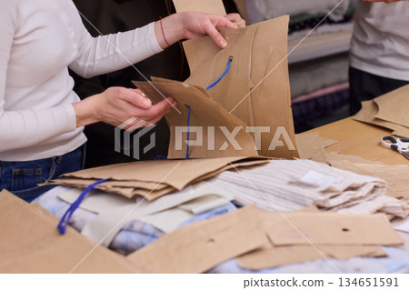 Tailoring Craftsmanship A Fashion Designer at Work Creating Beautiful Patterns with Precision 134651591