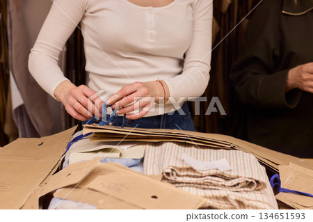 Tailoring Craftsmanship A Fashion Designer at Work Creating Beautiful Patterns with Precision Tailoring Craftsmanship A Fashion Designer at Work Creating Beautiful Patterns with Precision 134651593