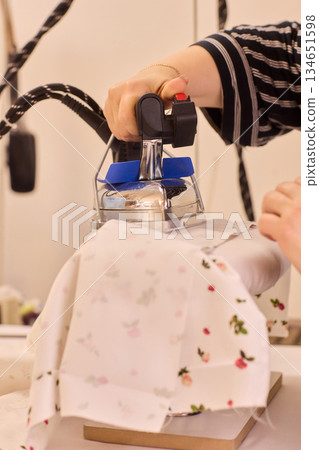 Ironing Clothes for a Neat, Tidy Finish at Home for Better Presentation and Appearance 134651598