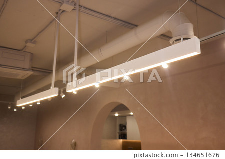 Lighting arrangement emphasizes fixtures and architectural features, Technical adjustments enhance product presentation through layered lighting and structural accents Lighting arrangement emphasizes fixtures and architectural features, Technical adjustments enhance product presentation through layered lighting and structural accents 134651676