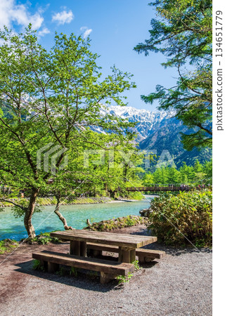 Spectacular views of Kamikochi: "The snow-capped Hotaka mountain range and the clear Azusa River" (Matsumoto City, Nagano Prefecture) 134651779