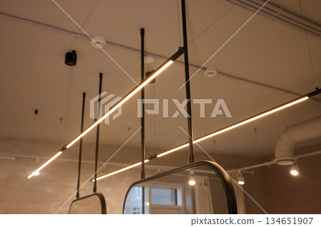 Lighting arrangement emphasizes fixtures and architectural features, Technical adjustments enhance product presentation through layered lighting and structural accents Lighting arrangement emphasizes fixtures and architectural features, Technical adjustments enhance product presentation through layered lighting and structural accents 134651907