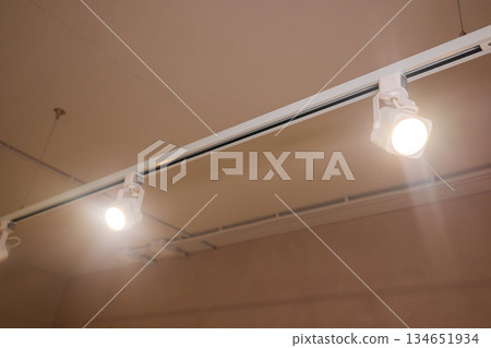 Lighting arrangement emphasizes fixtures and architectural features, Technical adjustments enhance product presentation through layered lighting and structural accents Lighting arrangement emphasizes fixtures and architectural features, Technical adjustments enhance product presentation through layered lighting and structural accents 134651934