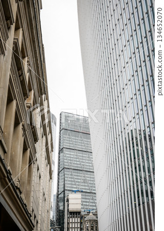Modern City Architecture with Tall Glass and Stone Office Buildings Modern City Architecture with Tall Glass and Stone Office Buildings 134652070