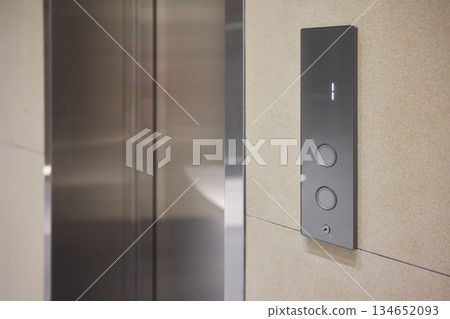 High-tech elevator panel featuring tactile buttons and illuminated screen, Advanced elevator interface showcasing touch sensitive controls alongside bright digital display screen High-tech elevator panel featuring tactile buttons and illuminated screen, Advanced elevator interface showcasing touch sensitive controls alongside bright digital display screen 134652093